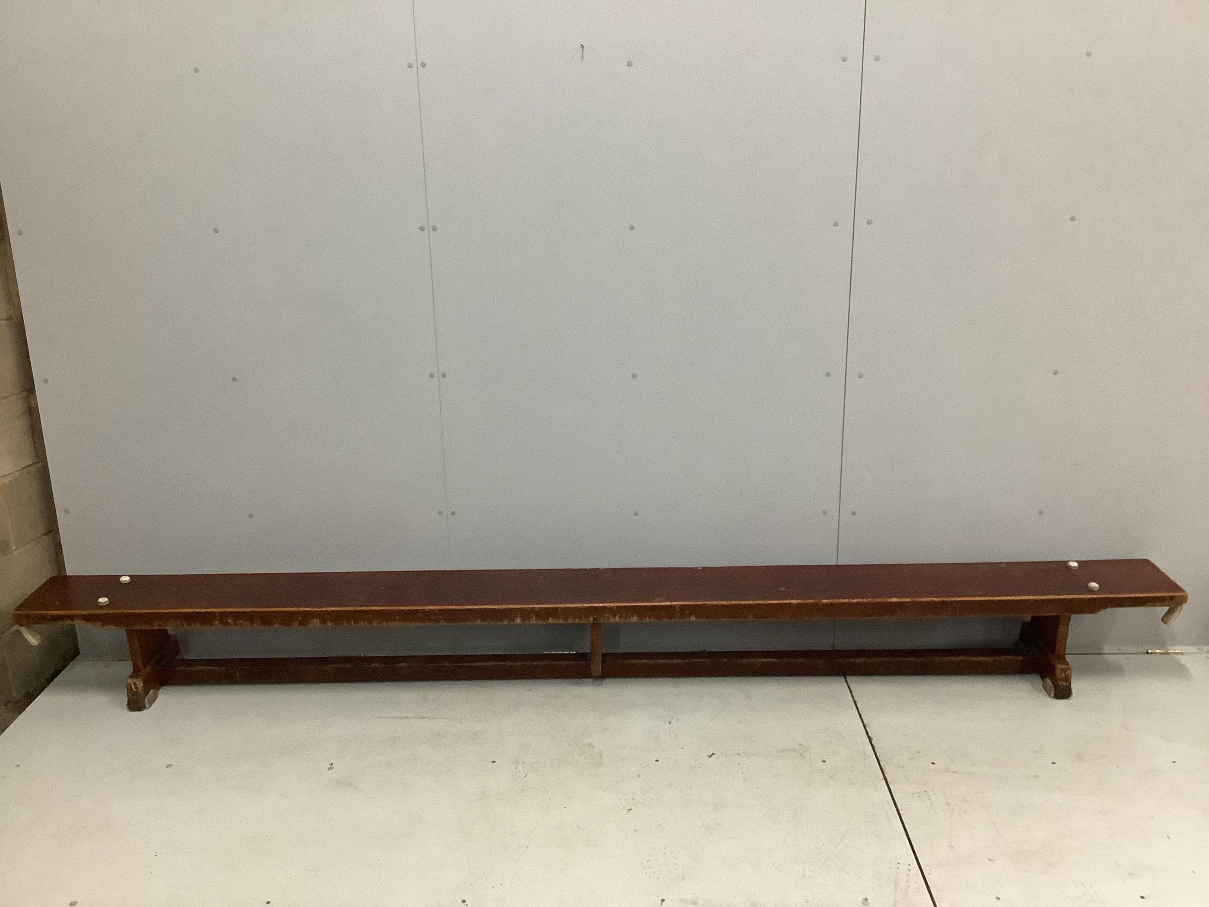 A set of three vintage stained beech gymnasium benches, length 335cm, height 31cm. Condition - well used but fair